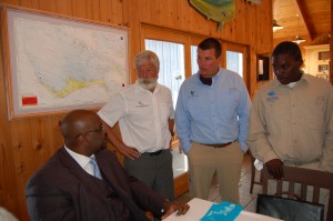 Aaron Shultz, David Philipp, and Malcolm Goodwin with the Prime Minister of the Bahamas