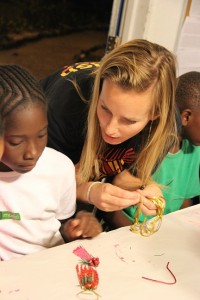 LREP Manager Dr. Jocelyn Curtis-Quick helps students plan the construction of holiday ornaments out of lionfish fins.