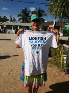 Ann holds up the lionfish slayer t-shirt she won in a drawing after signing up for The Cape Eleuthera Institute updates and newsletter