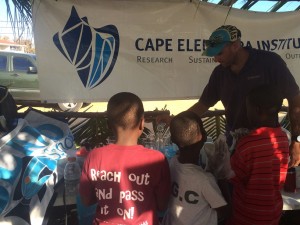 Mike Cortina, a member of the Center for Sustainable Development, teaches children how to make biodiesel from used vegetable oil (1)