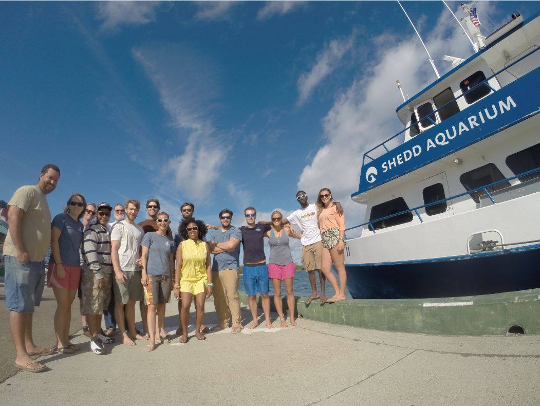 The researchers that took part in the Nassau grouper work in front of the Shedd Aquarium vessel